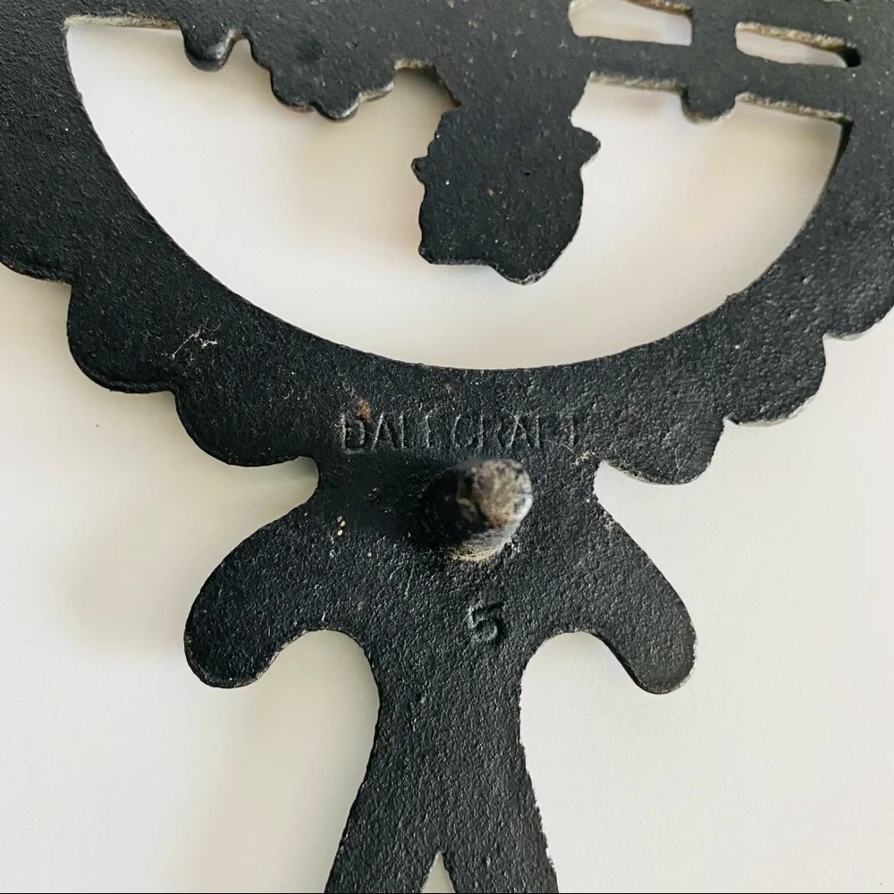 Vintage  Cast Iron Amish Woman and  man Trivets.